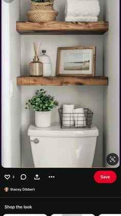 the bathroom is decorated in white and has shelves with pictures on them, plants and toilet paper