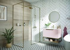 a bathroom with a pink vanity, mirror and shower in the corner next to a white bathtub