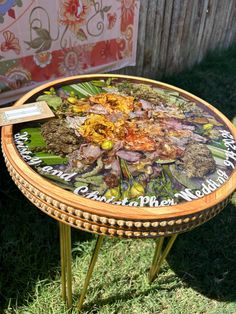 a wooden table with flowers painted on it