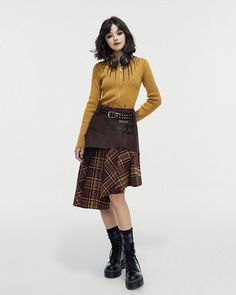 This asymmetrical brown skirt features a structured top section and a plaid bottom, accented with stylish buckles. The mix of materials and unique cut create an eye-catching piece Size:• S: Waist: 70cm/ 27.6 in, Length: 66cm/ 26.0 in• M: Waist: 74cm/ 29.1 in, Length: 68cm/ 26.8 in• L: Waist: 78cm/ 30.7 in, Length: 70cm/ 27.6 in Material: Polyester, Vegan Leather Fitted Asymmetrical Brown Skirt, Brown Fitted Asymmetrical Skirt, Fitted Brown Asymmetrical Skirt, Fall Asymmetrical Skirt With Belt Loops, Fall Patchwork Asymmetrical Skirt, Asymmetrical Fitted Brown Skirt, Edgy Asymmetrical Fall Skirt, Brown Asymmetrical Hem Skirt For Fall, Brown Patchwork Skirt For Fall