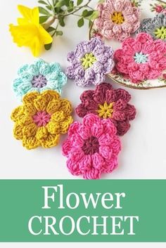 crochet flowers are arranged in different colors and sizes on a white surface with text overlay that reads, flower crochet