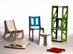 three chairs and a book shelf are shown in different colors on a white background, one is green, the other is blue