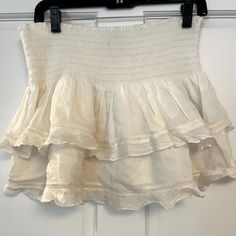 *Gently Used* Slight Stain As Pictured On The Back Cream Color Elastic Waistband With Little Lace Trim Feminine White Skirt With Ruffle Hem, White Tiered Skort With Ruffles, White Mini Skirt With Ruffle Hem, Summer White Skirt With Ruffle Hem, White Mini Skirt With Ruffle Hem For The Beach, White Ruffle Hem Skirt For Summer, White Ruffle Hem Skort, White Ruffled Skort, White Ruffle Hem Mini Skirt For Beach