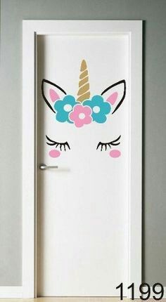 the door is decorated with an image of a unicorn's face and flowers on it