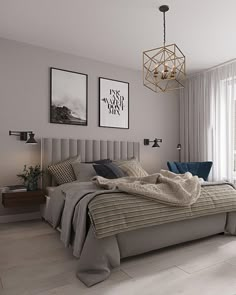 a bedroom with a large bed and two pictures on the wall