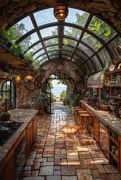 an outdoor kitchen with stone walls and arched ceiling, surrounded by greenery is shown in this image