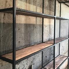 the shelves are lined with wire mesh and wood