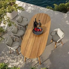 an aerial view of a dining table and chairs