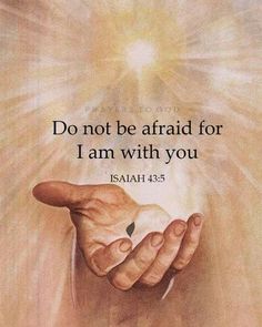 a hand holding an object with the words do not be afraid for i am with you