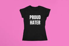 "Express yourself with our 'Proud Hater' Graphic Tee. This eye-catching shirt is perfect for those who march to the beat of their own drum. Made from soft, breathable fabric, it's comfortable enough for all-day wear. Available in sizes Small to 2X, because bold style comes in all shapes and sizes. Rock this tee with confidence and let the world know you're a proud hater!" Ready for a wardrobe upgrade? Follow us for the latest drops, exclusive deals, and style inspiration! Don't forget to tag us Iconic Shirts, Silly Shirt, Wardrobe Upgrade, Graphic Crop Top, 2000s Aesthetic, Shirt Y2k, Sarcastic Shirts, Bold Style, Fit Check