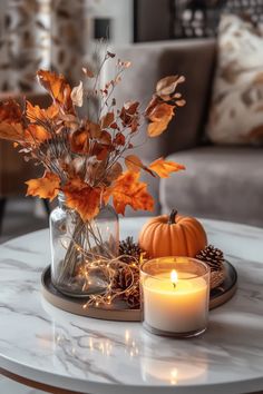 a candle and some flowers on a table