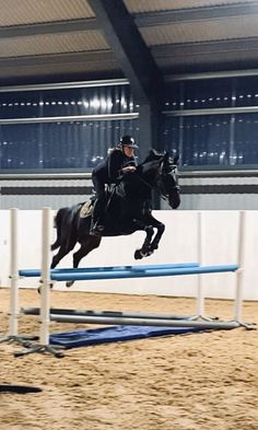 a man riding on the back of a horse jumping over an obstacle in an arena