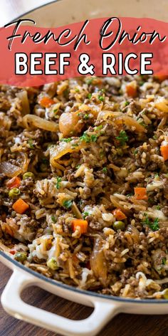 french onion beef and rice with carrots in a skillet on a wooden table