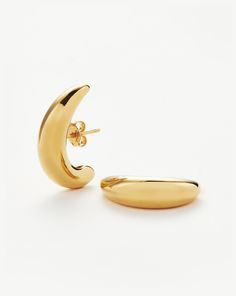 Savi Dome Cuff Stud Earrings 18ct Gold Plated. Pared-Back Modern Meets Vintage. These Sculptural Elongated Stud Earrings Hug the Ear from Inner to Outer Lobe with a Minimalist Domed Design. Fastening with a Butterfly Closure, Let Them Take Centre Stage in Your Ear Stack. A Collection Designed in Collaboration with the Beijing-Born Tastemaker Behind Savislook, Inspired by Architecture and Organic Forms. Metal: 18Ct Recycled Gold Plated on Brass Dimensions: 23. 52mm X 7mm Weight: 7. 81g this Piece Double Chain Bracelet, Large Stud Earrings, Organic Forms, Ear Stack, Gemstone Beaded Necklace, Recycled Metal, Recycled Gold, Coin Necklace, Recycled Sterling Silver