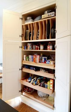 an organized kitchen pantry with lots of food