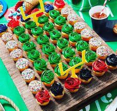 cupcakes are arranged in the shape of an american flag on a cutting board