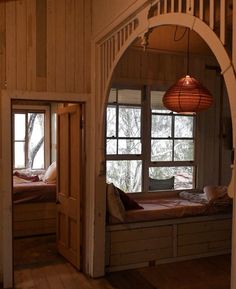 a room with two beds and a window