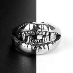 The Devil Mouth Teeth Rings are bold and edgy accessories that make a striking statement. With their intricate design resembling devilish teeth, these rings exude a daring and rebellious vibe. Crafted with attention-grabbing details, they add a unique and distinctive touch to any outfit. Whether worn as a fashion statement or to express a darker aesthetic, these rings are sure to turn heads and spark conversation. Flaunt your fearless style with the Devil Mouth Teeth Rings, perfect for those una Vamp Teeth, Teeth Ring, Darker Aesthetic, Mouth Ring, Vampire Mouth, Cat Teeth, Tooth Ring, Vampire Teeth, Edgy Accessories