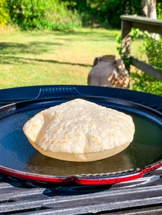 a tortilla sitting on top of a blue pan