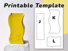 a yellow vase sitting on top of a cement block next to a printable template