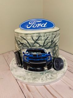 a birthday cake with a ford truck on it