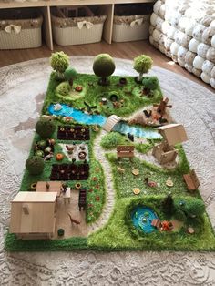 a play area with grass and toys on the floor