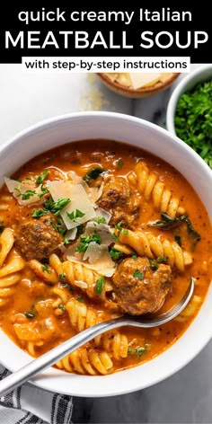 a bowl of meatball soup with pasta and parmesan cheese on the side