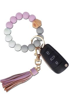 A photo of a silicone beaded key ring bracelet. The bracelet is made of soft, durable silicone and features a variety of colorful beads. A metal key ring and leather tassel are attached to the bracelet.

This alt text is descriptive and accurate, and it would be helpful for people who are visually impaired or using screen readers. It also includes the relevant keywords, such as "silicone beaded key ring bracelet," "wristlet," and "keyholder." Beaded Keychain Bracelet, Key Ring Bracelet, Car Key Holder, Car Key Ring, Silicone Ring, Tassel Bracelet, Chapstick Holder, Silicone Bracelets, Silicone Rings