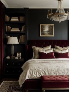 a bedroom with black walls and red bedding