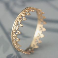 This listing is for ONE ring--in solid 14K yellow gold. The silver version is available here: https://www.etsy.com/listing/119435317 Hand formed from solid 14K yellow gold patterned gallery wire, your ring can be made in any size. Each ring measures 4.5mm wide by .5mm thick. It features a popular heart inspired crown design. Because of the pattern, we will match it up as best as I can and get as close to your size as possible. Blazer Arts is a family-owned and operated small but growing business Gold Crown Ring, Ring Crown, Heart Band, Ring Heart, Crown Design, Crown Ring, Gold Crown, Gold Pattern, One Ring