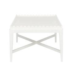 a white tray with holes on the top and bottom, sitting on a white table