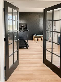 an open door leading to a gym room