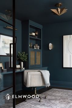 a living room with blue walls and a white rug on the floor in front of it