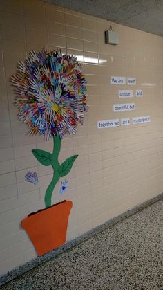 there is a flower on the wall in the hallway