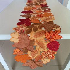 a long table with many leaves on it