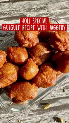 a glass dish filled with doughnuts on top of a wooden table next to nuts