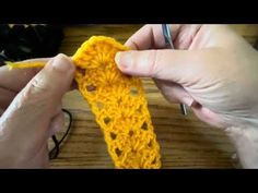 someone is crocheting an object with yellow yarn