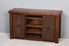 a wooden cabinet with two doors and shelves