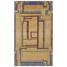 a rug with an abstract design on the front and back side, in yellow and blue tones