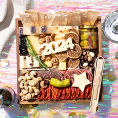 a wooden box filled with different types of food