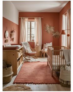 a baby's room with an orange wall and pink rugs on the floor