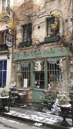 an old building with snow on the ground