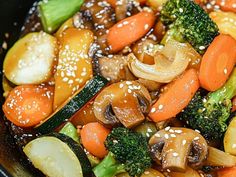 stir fry with vegetables and sesame seeds in a wok