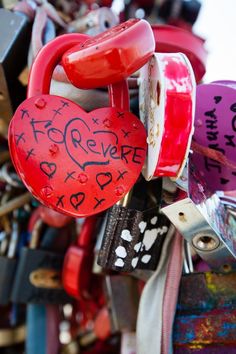 a bunch of locks with hearts attached to them