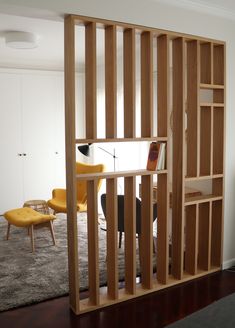 an open book shelf in the middle of a living room