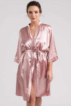 "This 3-pieces set is cut from blush pink soft satin in a kimono-inspired silhouette. It consists of the robe, camisole and shorts. It has a relaxed fit and detachable sash belt to keep it secure. Premium glass rhinestones embellish robe's back with the sparkly graphic \"BRIDE\". Excellent to be worn on the morning of the wedding or the night before your special day. Everyone will love this gorgeous loungewear set and you will look stunning in your getting ready photographs. It is available in S Satin Bridal Robe, In Bloom By Jonquil, Personalized Robe, Silk Nightgown, Traditional Kimono, Bridal Wrap, Satin Kimono, Lounge Outfit, Wedding Robe