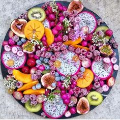 a platter filled with different types of fruit