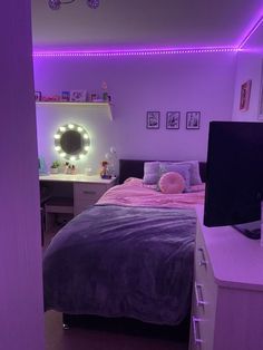 a bed room with a neatly made bed and purple lighting