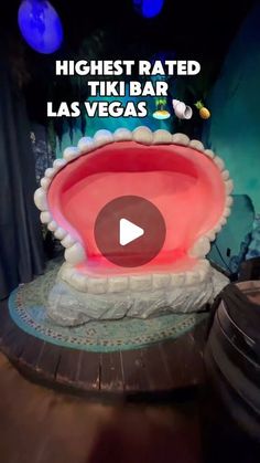 an image of a fake tooth in the middle of a stage with words that read highest rated tiki bar las vegas