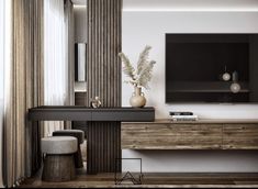 a living room with a large tv mounted on the wall next to a wooden table